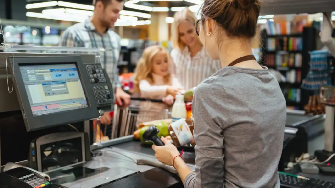 a lady operating POS software in supermarket in UAE