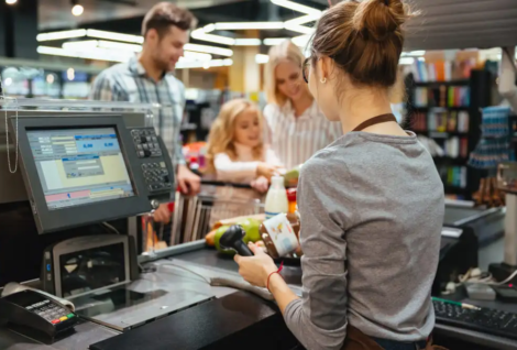 a lady operating POS software in supermarket in UAE